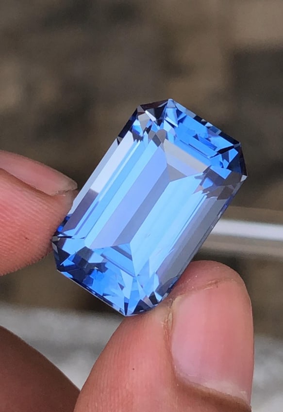 GFCO Certified Santa Maria Blue Aquamarine Emerald Shape Gemstone From Minas Gerais Mine Brazil -: Aquamarine Details: * Weight : 22.52 carat * Dimension : 20.97*13.27*10.92 mm * Shape : Emerald * Color : Blue * Origin : Brazil * Luster: Vitreous * Mineral Class : Beryl * Certificate : GFCO * SKU :