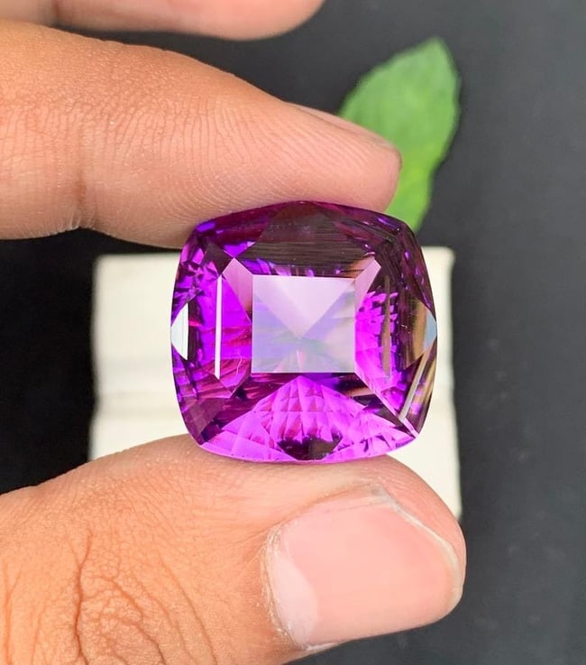 Fancy Cushion Cut Natural Purple Amethyst Gemstone For Jewelry - 34 Carat: Amethyst Details * Weight : 34 carat * Dimension : 26*26*14 mm * Color : Purple * Clarity : Loupe Clean * Shape : Concave Cut * Hardness : 6.5 - 7 * Mineral Class : Beryl * Luster: Vitreous *