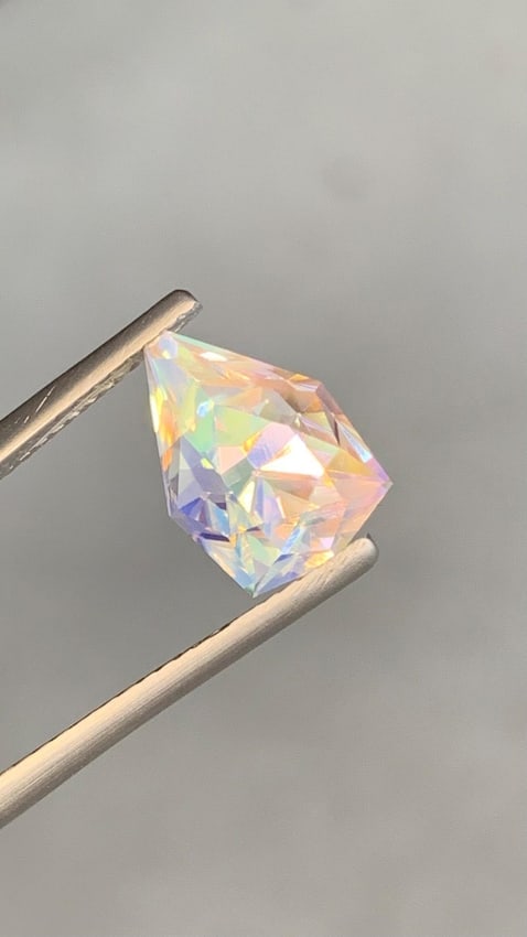 3.57 Ct Natural Multi-Color Moonstone - Rare Modified Pear Cut - 10mm Untreated "Teardrop" Gem with: Product Description Capture the magic of the moonlight with this exquisite Modified Pear Cut Moonstone. This 3.57-carat gem is a masterwork of natural beauty and precision cutting. Unlike standard