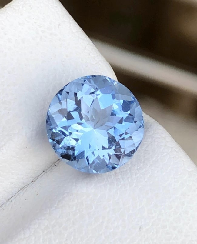 Natural Blue Aquamarine Round Shape Gemstone From Minas Gerais Mine Brazil - 4.190 Carat: Aquamarine Details: * Weight : 4.190 carat * Dimension :10.3*10.3*7.2 mm * Shape : Round * Color : Blue * Origin : Brazil * Luster: Vitreous * Mineral Class : Beryl * Certificate : On Customer Demand 