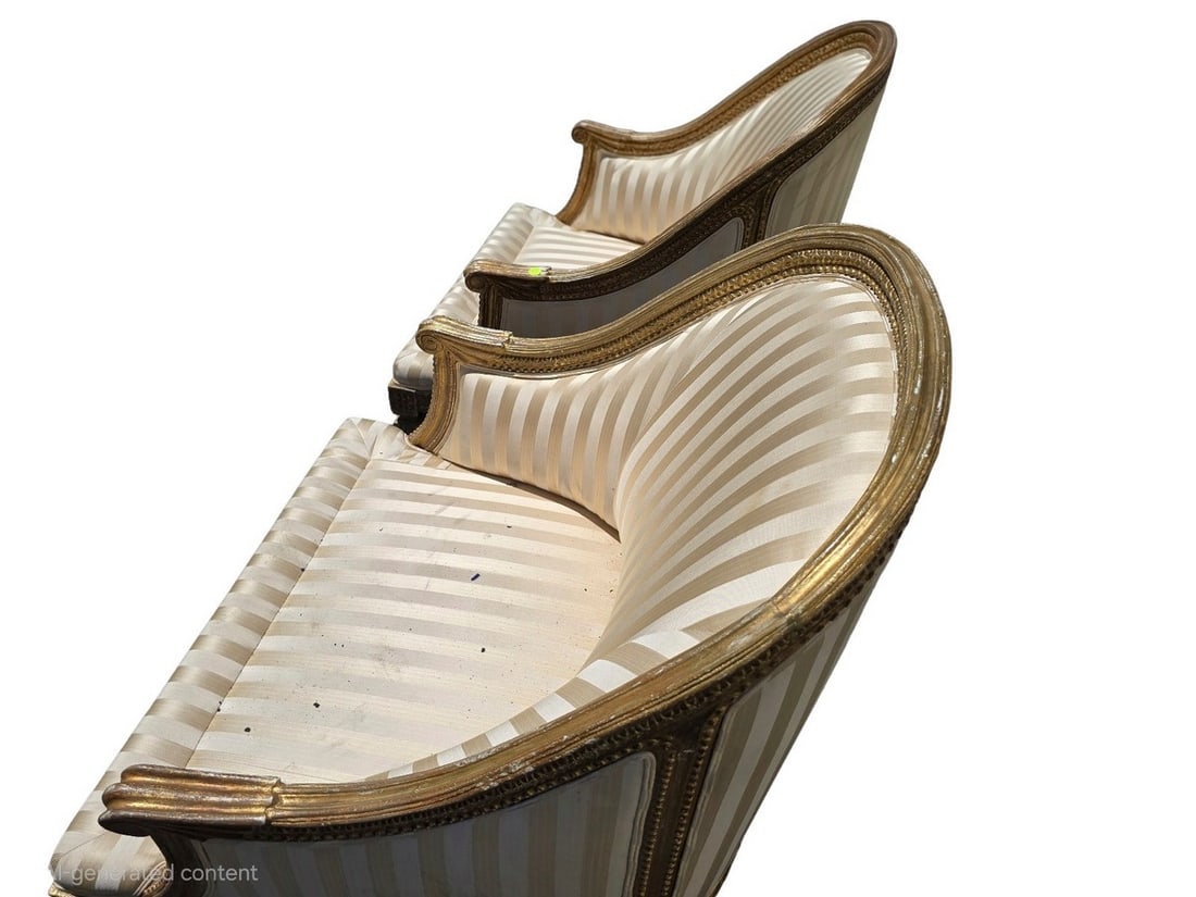 Pair of Giltwood and Striped Upholstered Bergeres: A elegant pair of bergeres featuring giltwood frames with carved details and upholstered in a striped cream and gold fabric. The chairs have a classic French style, suitable for a refined living