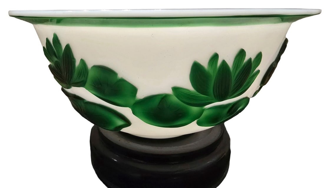 Vintage Milk Glass Bowl with Green Applied Decoration: This charming vintage milk glass bowl features applied green glass decoration resembling leaves or floral motifs. The interior of the bowl is a smooth white milk glass, while the exterior showcases