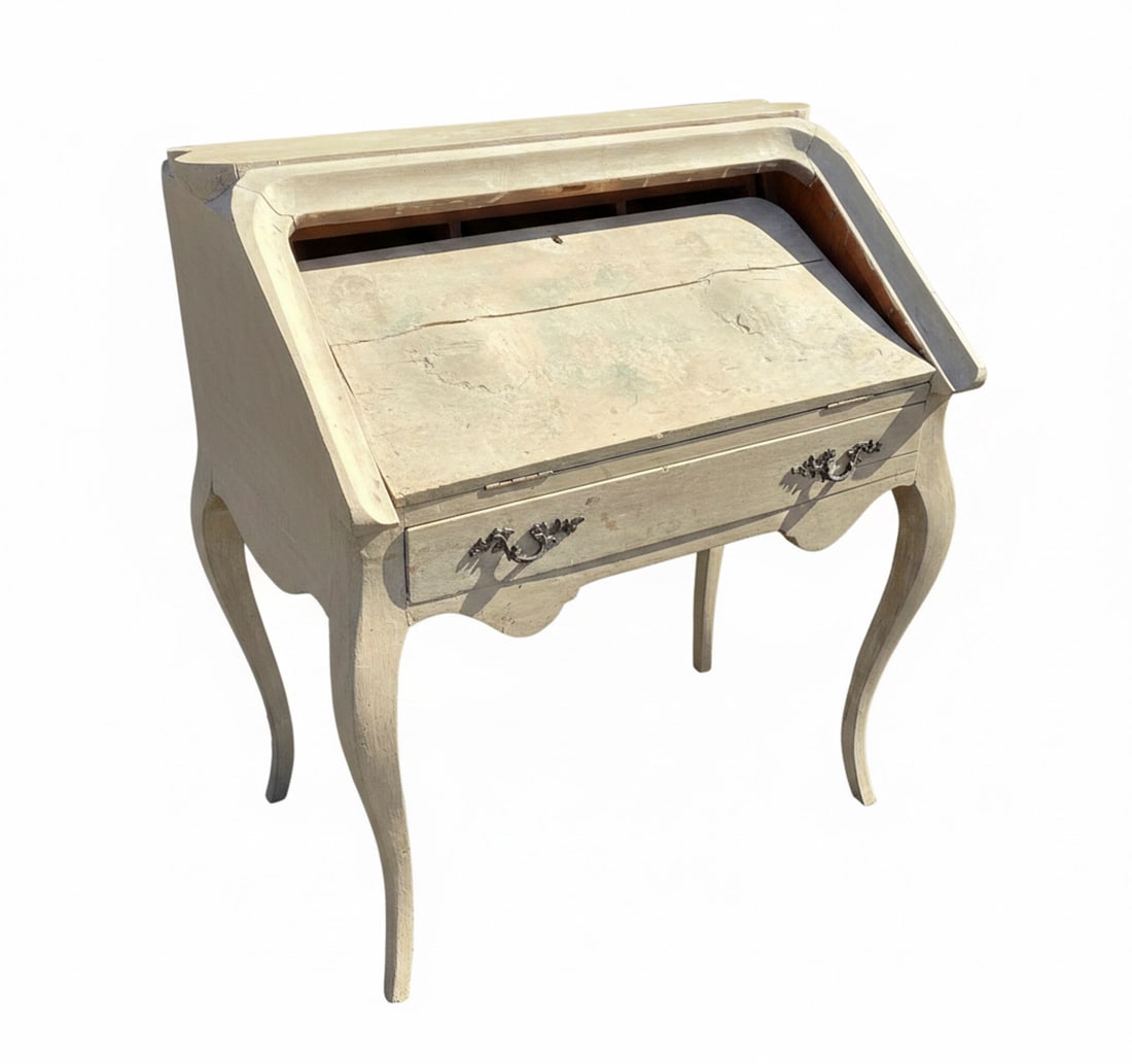 French Provincial Style Painted Wood Bureau Plat / Desk: A charming French Provincial style bureau plat or desk, featuring a distressed painted finish and elegant curved legs. The desk has a single drawer with ornate metal pulls and a slanted fall front tha