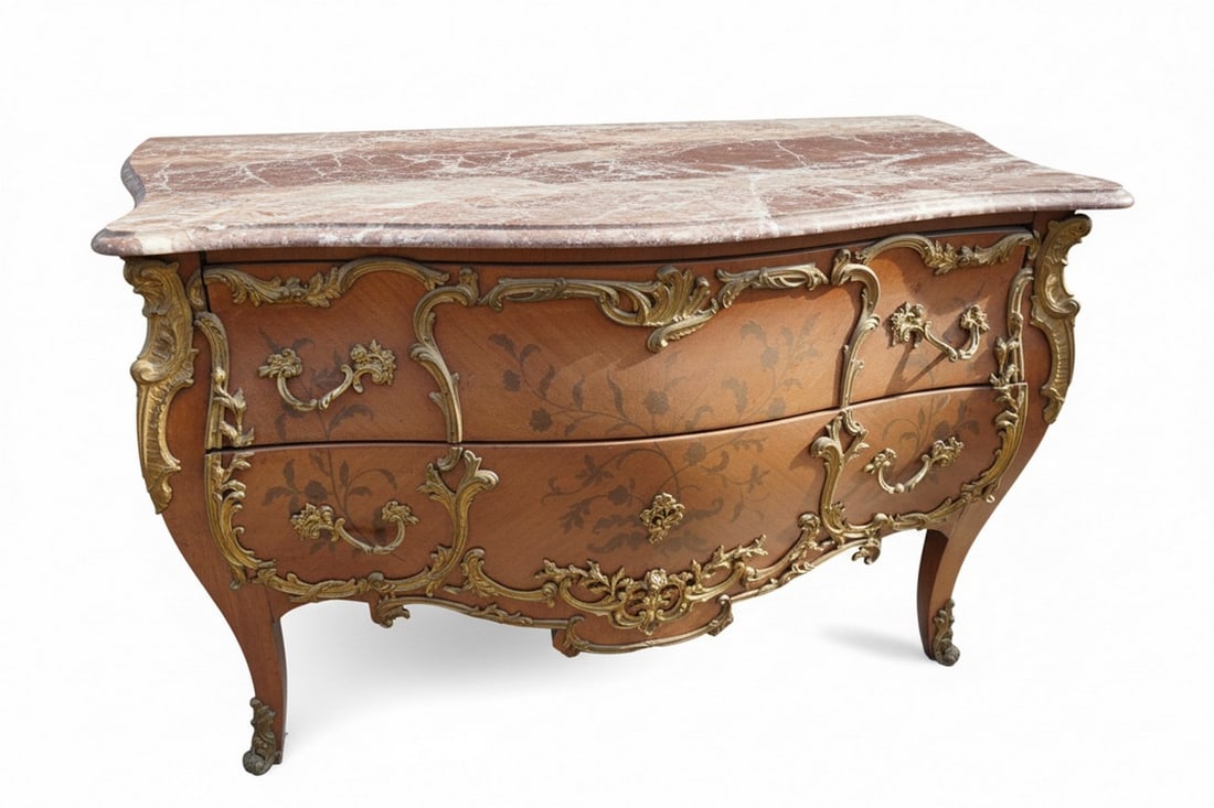 Louis XV Style Gilt Bronze Mounted Commode with Marble Top: A bombe-shaped commode in the Louis XV style, featuring ornate gilt bronze mounts and a variegated marble top. The commode has two drawers with floral marquetry or painted decoration and stands on