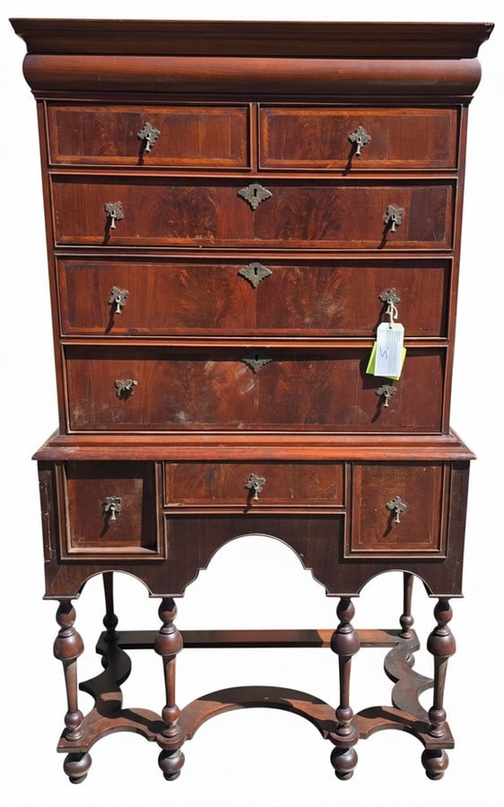 Antique Carved Mahogany Highboy Chest of Drawers: An antique carved mahogany highboy chest of drawers, likely English or American, 18th or early 19th century. The upper case features two small drawers over three graduated full-width drawers, all with