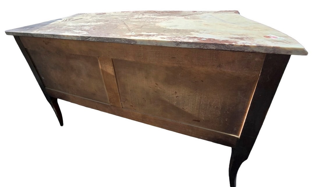 Vintage French Marble Top Server / Console Table: A vintage French server or console table featuring a distressed rectangular marble top with rounded corners, over a wooden base with two paneled sections. The table stands on four elegant, curved legs