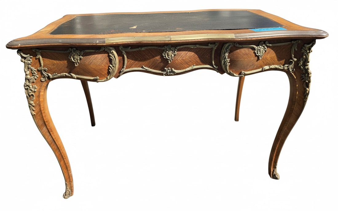 Louis XV Style Gilt Bronze Mounted Kingwood and Leather Top Bureau Plat: A sophisticated Louis XV style bureau plat, or writing desk, featuring a rich kingwood veneer with intricate parquetry. The desk is adorned with ornate gilt bronze mounts, including sabots,