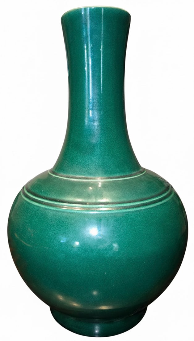 Chinese Emerald Green Glazed Crackleware Vase: This elegant vase features a vibrant emerald green glaze with a distinctive crackleware finish, characteristic of traditional Chinese ceramics. The body is globular, tapering to a slender, flared neck