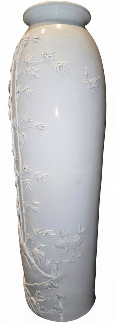 Chinese Export Porcelain White Glaze Vase with Embossed Bamboo and Birds: This white-glazed porcelain vase features intricately embossed bamboo stalks, birds, and floral motifs. The design suggests a traditional Chinese aesthetic, possibly from the early to mid-20th