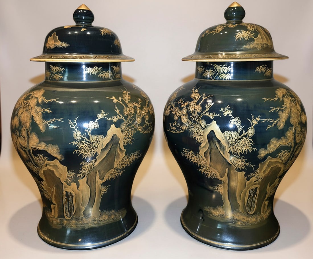 Pair of Monumental Chinoiserie Black and Gilt Ginger Jars: A magnificent pair of large ginger jars, featuring a rich black glaze adorned with intricate gilt chinoiserie decoration. The design depicts traditional Asian landscapes with mountains, trees, and
