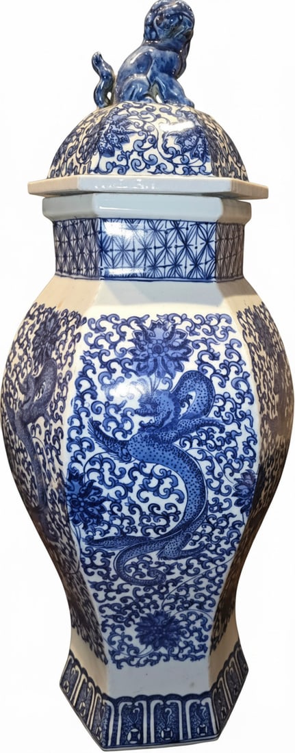 Large Hexagonal Blue and White Porcelain Dragon Motif Jar with Foo Dog Finial: A large hexagonal porcelain lidded jar, decorated with traditional blue and white underglaze motifs. The body features dragons amidst scrolling clouds and floral patterns, while the lid showcases a si
