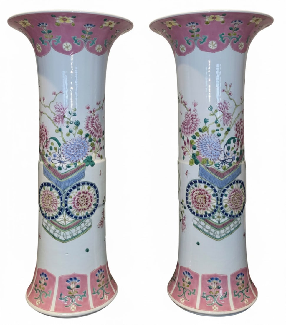 Pair of Chinese Famille Rose Porcelain Vases: A matching pair of Chinese Famille Rose porcelain vases, each featuring a trumpet-form neck and a flared base. The body is decorated with vibrant floral motifs in pink, blue, green, and yellow hues, a