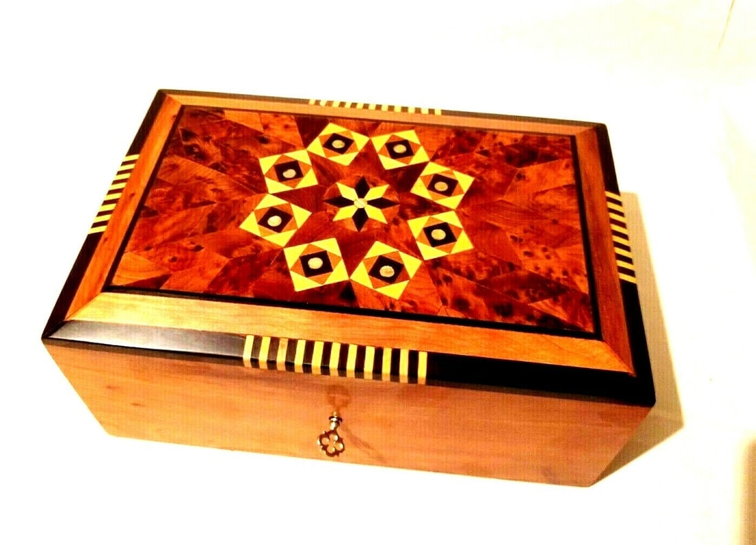 Inlaid Thuya Burl Wood Jewelry Box: Inlaid Thuya Burl Wood Jewelry Box is a carefully crafted piece combining practical function with a distinctive, timeless design. Material: Wood. Shape: Rectangle. Craftsmanship: Handmade. Ideal for p