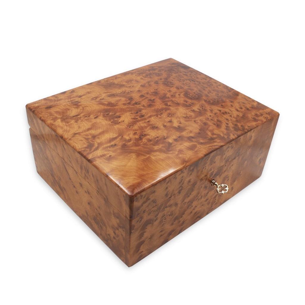 Lockable Thuya Burl Wood Jewelry Box: Lockable Thuya Burl Wood Jewelry Box is a carefully crafted piece combining practical function with a distinctive, timeless design. Measurements: Length: 22 cm; Width: 18 cm; Height: 10 cm. Material: