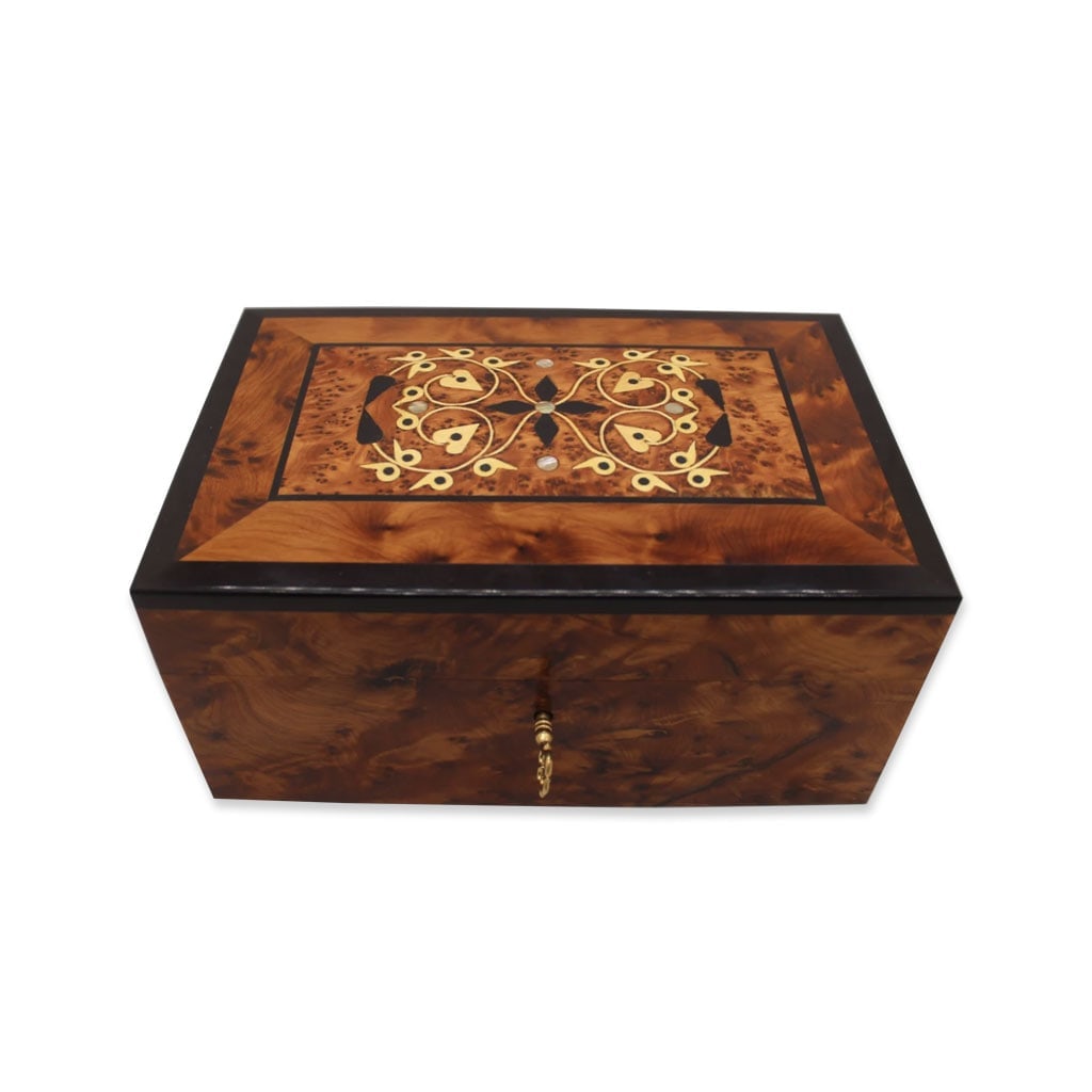 Lockable Thuya Burl Wood Jewelry Box: Lockable Thuya Burl Wood Jewelry Box is a carefully crafted piece combining practical function with a distinctive, timeless design. Measurements: Length: 20 cm; Width: 13 cm; Height: 9.5 cm.