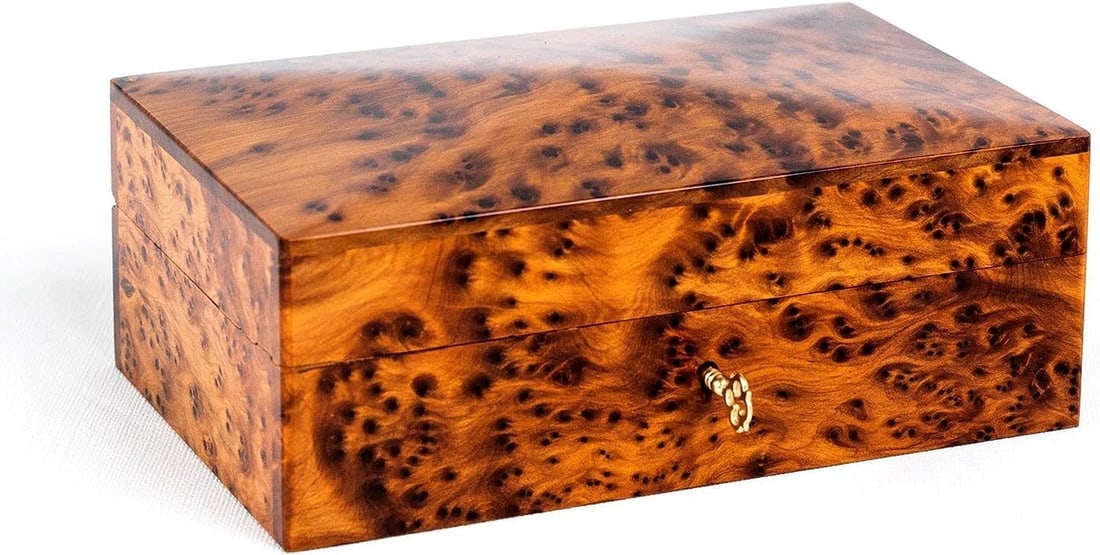 Lockable Thuya Burl Wood Jewelry Box – 6" × 4.35" × 3": Lockable Thuya Burl Wood Jewelry Box – 6" × 4.35" × 3" is a carefully crafted piece combining practical function with a distinctive, timeless design. Measurements: Item Length: 6 inches; Item