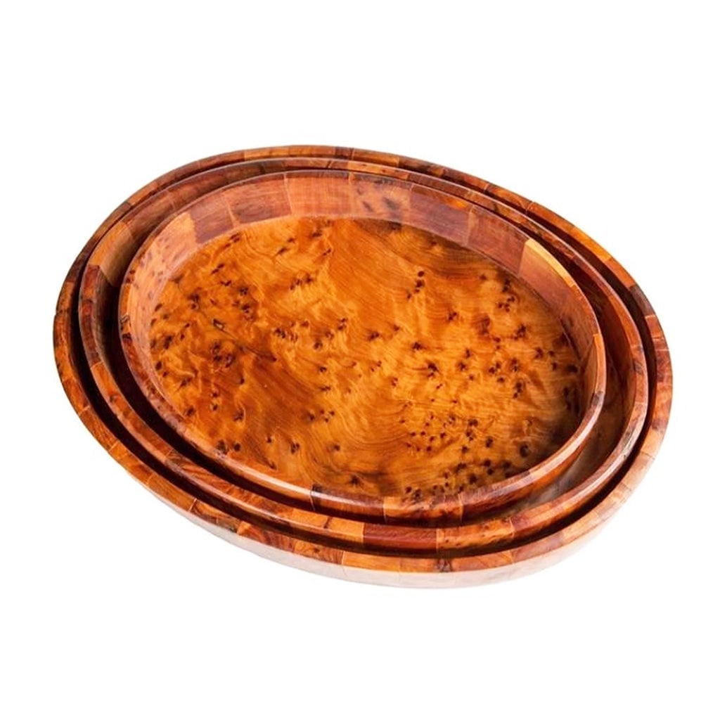 Handcrafted Oval Thuya Wood Serving Trays – Set of 3: Oval Thuya Wood Serving Tray - Set of 3 is a carefully crafted piece combining practical function with a distinctive, timeless design. Measurements: Length: 26 cm; Length: 29 cm; Length: 33 cm;