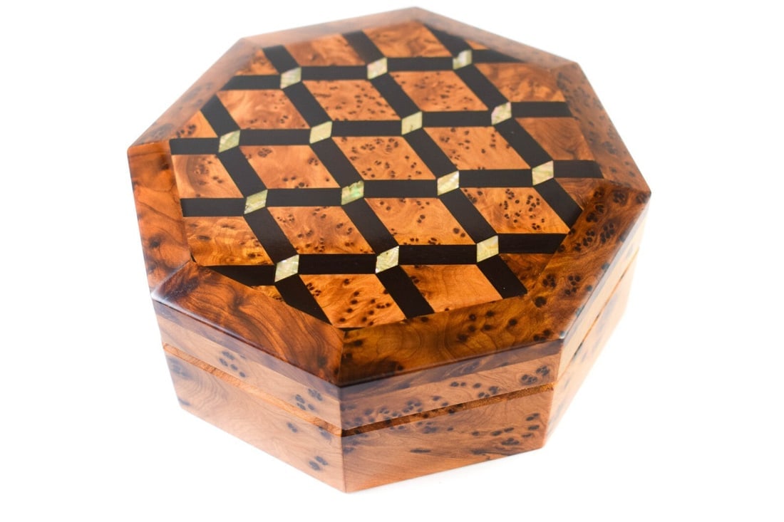Handcrafted Thuya Burl Wood Jewelry Box: Thuya Burl Wood Jewelry Box is a carefully crafted piece combining practical function with a distinctive, timeless design. Measurements: Item Length: 6.25 in; Item Depth: 2.5 in; Length: 6.25 in;