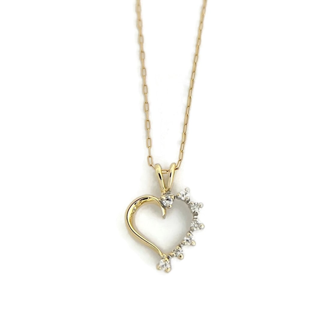 Half Diamond Heart Pendant Necklace 14K Yellow Gold, 1.18 Grams: Title: Half Diamond Heart Pendant Necklace 14K Yellow Gold, 1.18 Grams Description: Half Diamond Heart Pendant Necklace 14K Yellow Gold, 1.18 Grams This is a beautiful and unique necklace that's