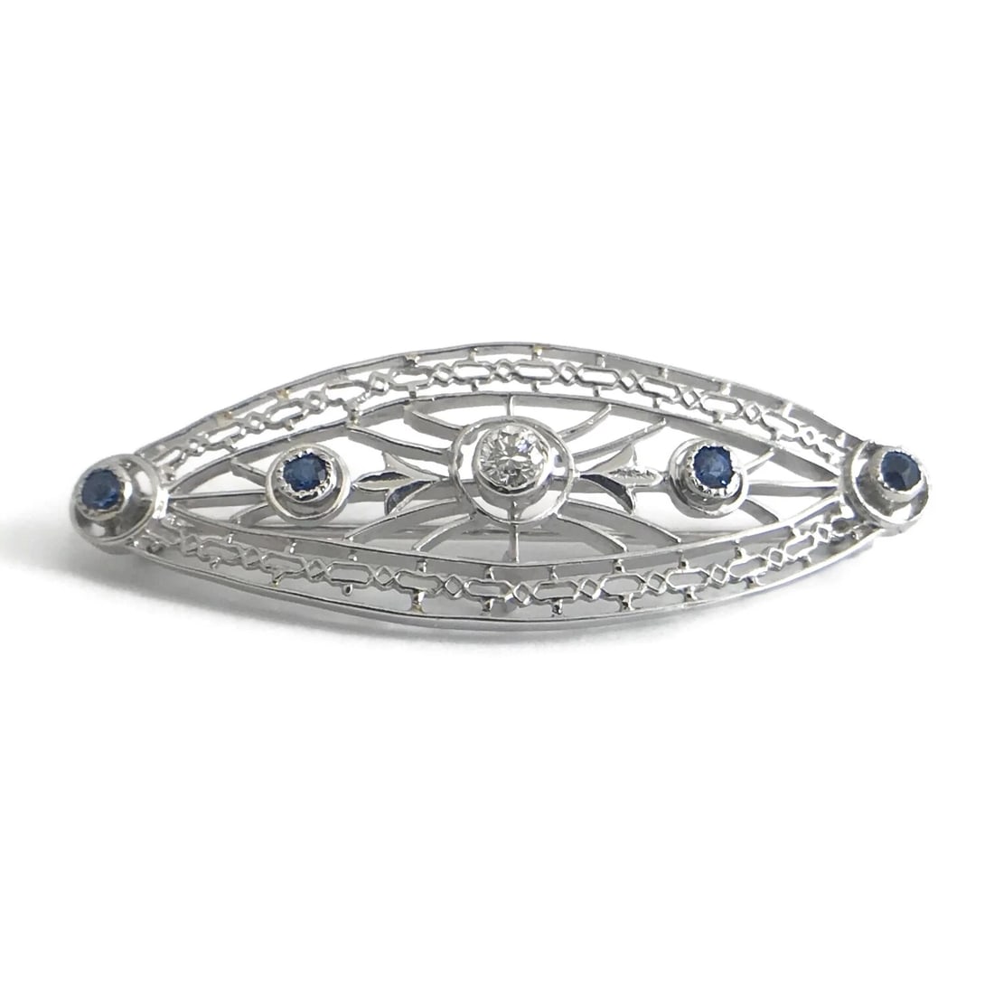 Vintage 1950's Blue Sapphire Diamond Platinum Brooch Pin, .30 CTW, 4.96 Gr: Title: Vintage 1950's Blue Sapphire Diamond Platinum Brooch Pin, .30 CTW, 4.96 Gr Description: Vintage 1950's Blue Sapphire Diamond Platinum Brooch Pin, .30 CTW, 4.96 Gr Make a statement with this