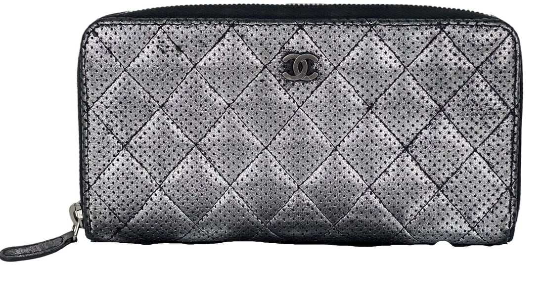 Chanel Wallet Perforated Silver Metallic Lambskin Quilted Zip Around: Title: Chanel Wallet Perforated Silver Metallic Lambskin Quilted Zip Around Description: Pre-Owned 100% Authentic Chanel Perforated Silver Metallic Lambskin Quilted Zip Around Wallet Clutch RATING: