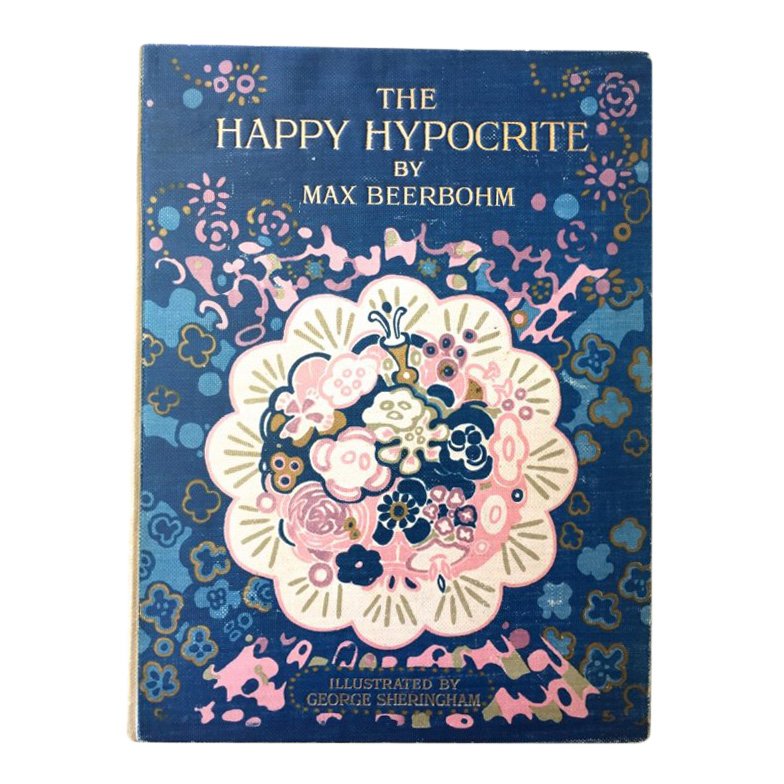 The Happy Hypocrite: Beerbohm, Max. [Sheringham, George] The Happy Hypocrite. London: Johnn Lane, 1915. First edition. 4to. Elaborately illustrated beige cloth with gilt lettering cover and spine. Illustrated endpapers, 1