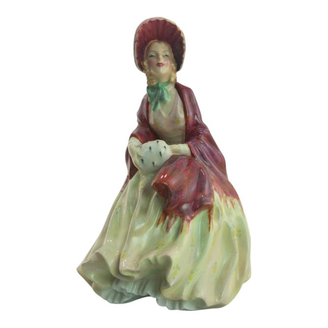 Royal Doulton Figurine: Her Ladysmith: Maker: Royal Doulton Title: Her Ladysmith Size: 7.5 inches tall Date: 1945-59 Reference: HN1977 Royal Doulton is an English company producing tableware and collectables, dating from 1815. Operating or