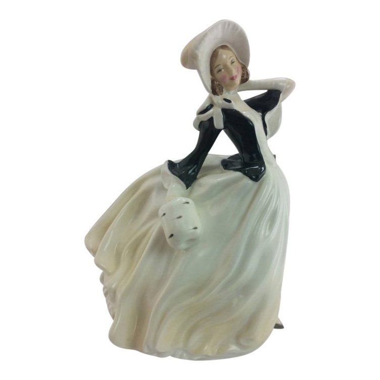 Royal Doulton Figurine: Autumn Breeze: Maker: Royal Doulton Title: Autumn Breeze Size: 7.5 inches tall Date: 1955 -71 Reference: HN2147 Royal Doulton is an English company producing tableware and collectables, dating from 1815. Operating o