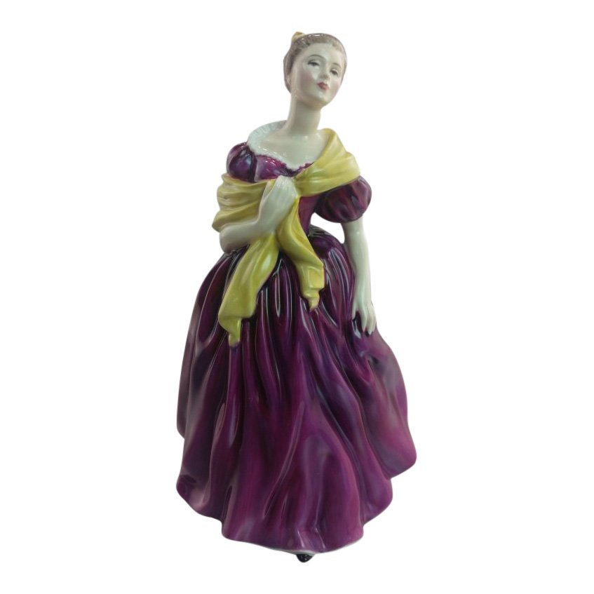 Royal Doulton Figurine: Adrienne: Maker: Royal Doulton Title: Adrienne Size: 7.5 inches tall Date: 1964-76 Reference: HN2152 Royal Doulton is an English company producing tableware and collectables, dating from 1815. Operating origina