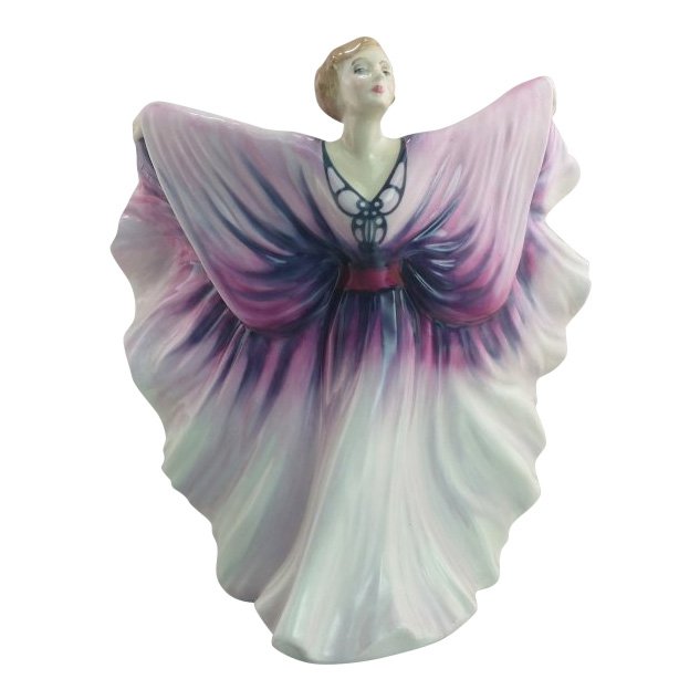 Royal Doulton Figurine: Isadora: Maker: Royal Doulton Title: Isadora Size: 8 inches tall Date: 1986-92 Reference: HN2938 Royal Doulton is an English company producing tableware and collectables, dating from 1815. Operating originally