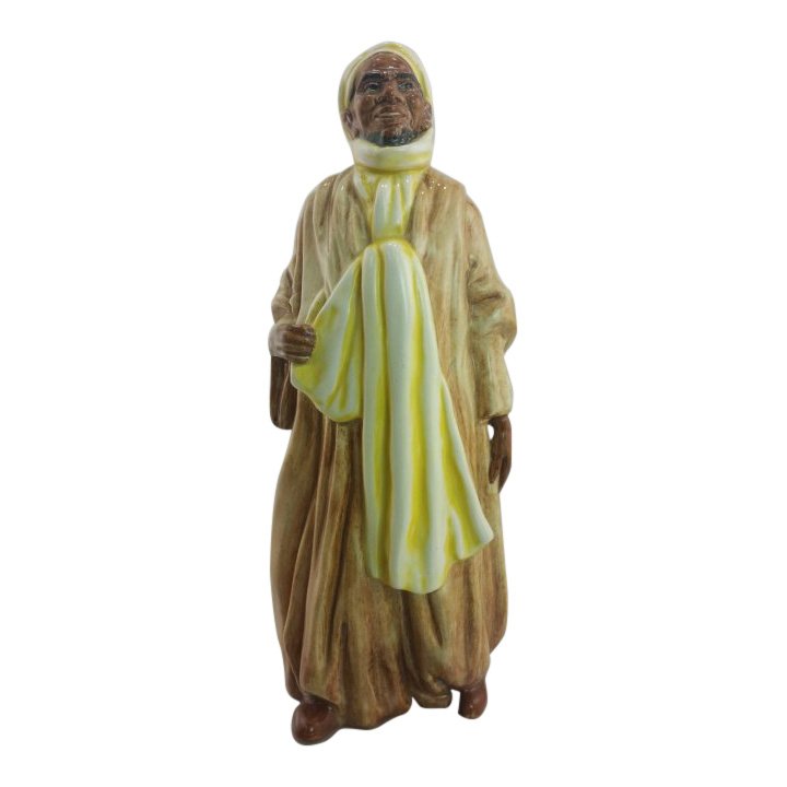 Royal Doulton Figurine: Ibrahim: Maker: Royal Doulton Title: Ibrahim Size: 7.5 inches tall Date: 1953-55 Reference: HN2096 Royal Doulton is an English company producing tableware and collectables, dating from 1815. Operating original
