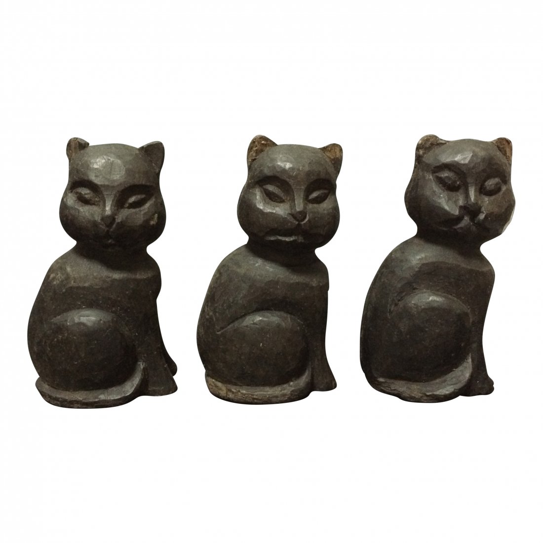 3 Cats: 3 Cat Wood Carvings Origin: Philippines Materials: "Takaan" Wood Carving Paper Mache Mold Dimensions: Each is 5 inches high x 3 inches wide Takaan carvings are unique, handmade wooden folk sculptures