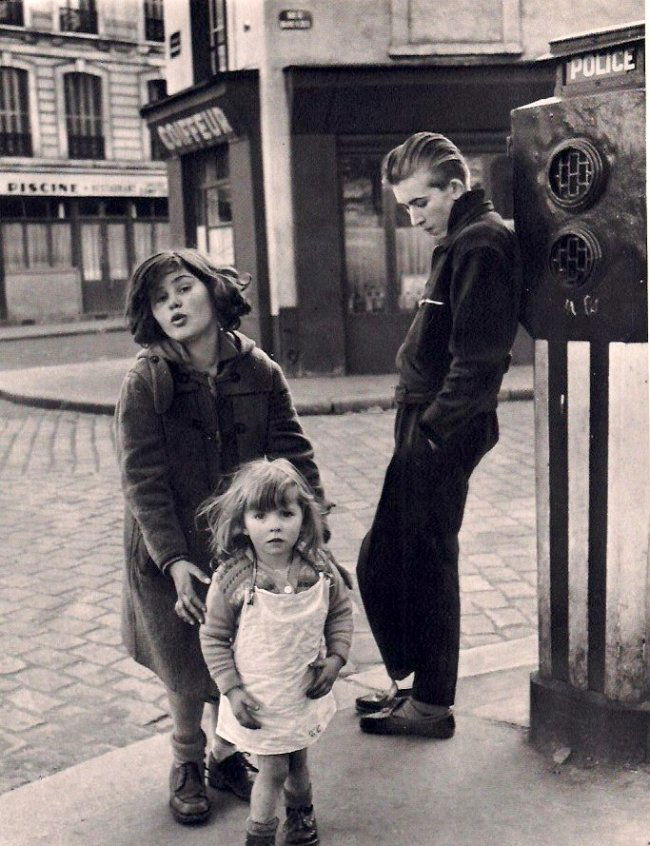 Robert Doisneau: Kids in the Place Hebert, 1957: Medium: Vintage Sheet-Fed Gravure Date: 1979 Printer: Presses Des Imprimeries, France Image Size: 7 x 9 inches Robert Doisneau was a French photographer. Similar to acclaimed photographer Henri Cartie