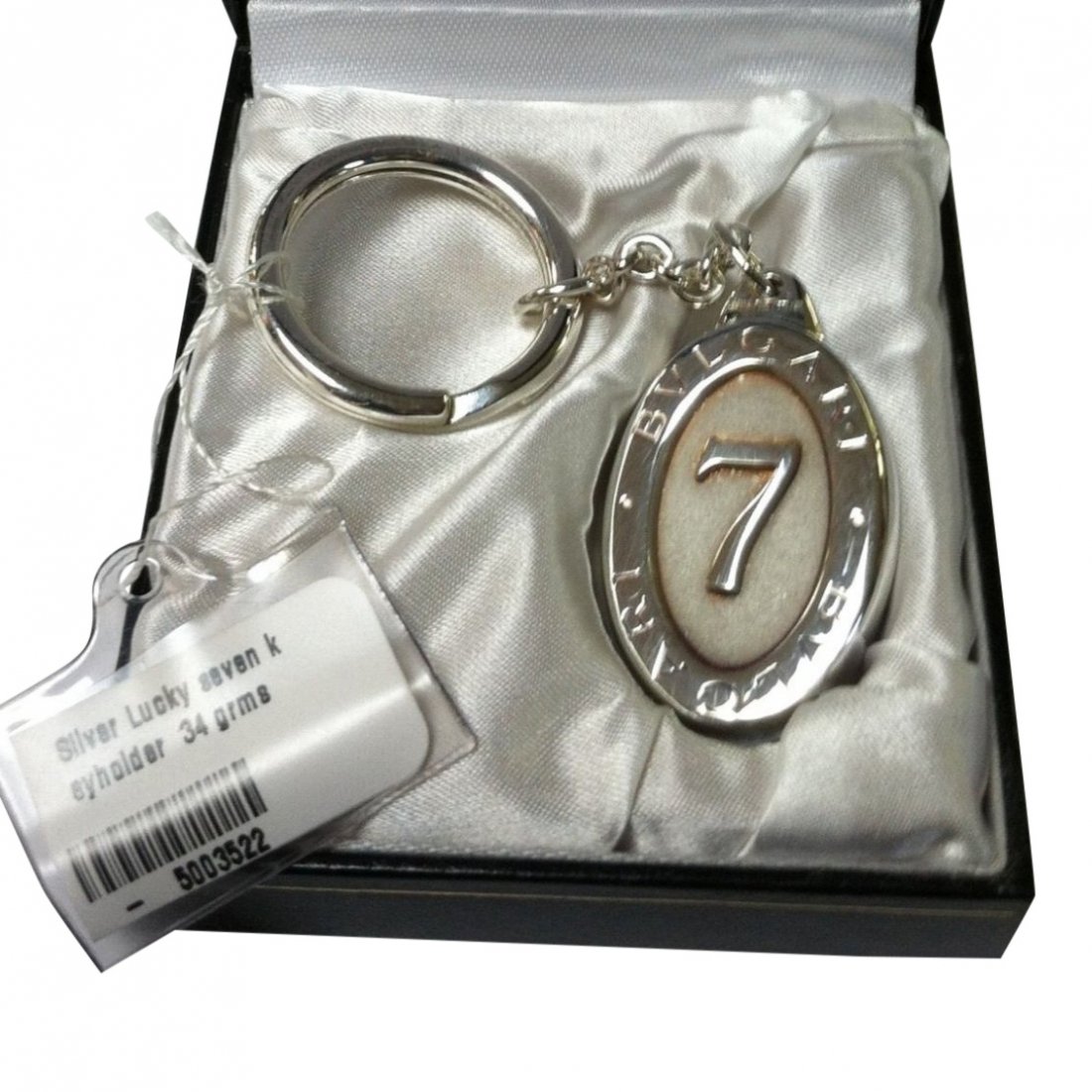 Bulgari Sterling Silver Lucky Seven Keychain: Bulgari sterling silver oval keychain with lucky 7 logo. Comes in fitted Bulgari box with tags. Materials: Sterling silver Please note that this lot has a reserve. When you leave a bid in advance of t