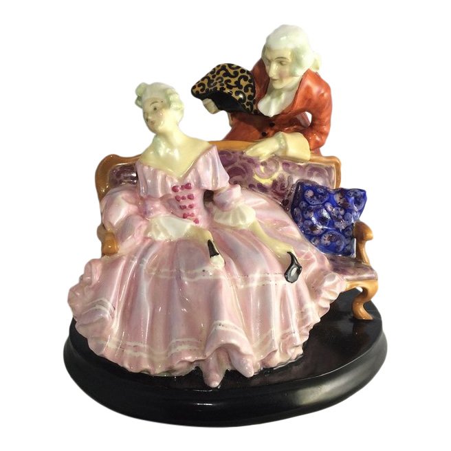Royal Doulton Figurine: Tete-a-Tete: Maker: Royal Doulton Title: Tete-a-Tete Reference #: HN798 Size: 5.75 inches Date: 1926-1938 Royal Doulton is an English company producing tableware and collectables, dating from 1815. Operating origi