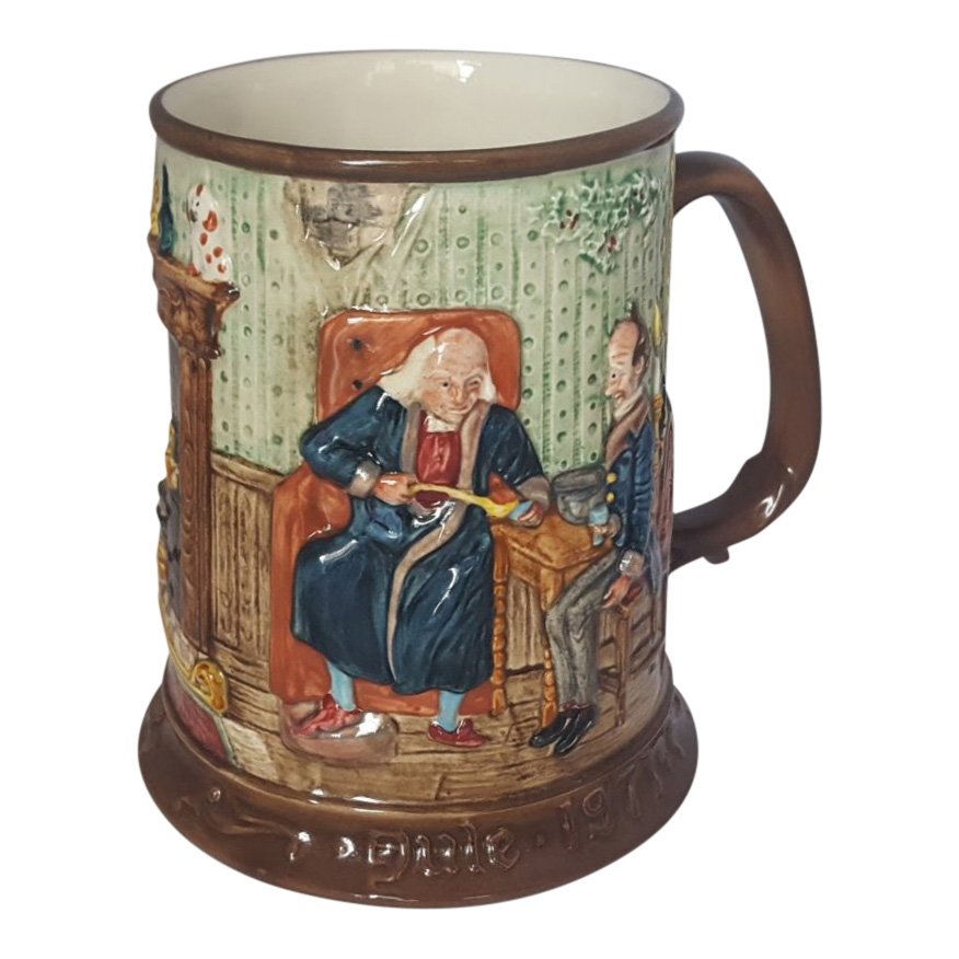 Royal Doulton Figurine: Dickens Christmas Tankard: Maker: Royal Doulton Item: Beswick Dickens Christmas Tankard Date: 1971 Size: 5 inches tall Reference: T1971 Royal Doulton is an English company producing tableware and collectables, dating from 1815.
