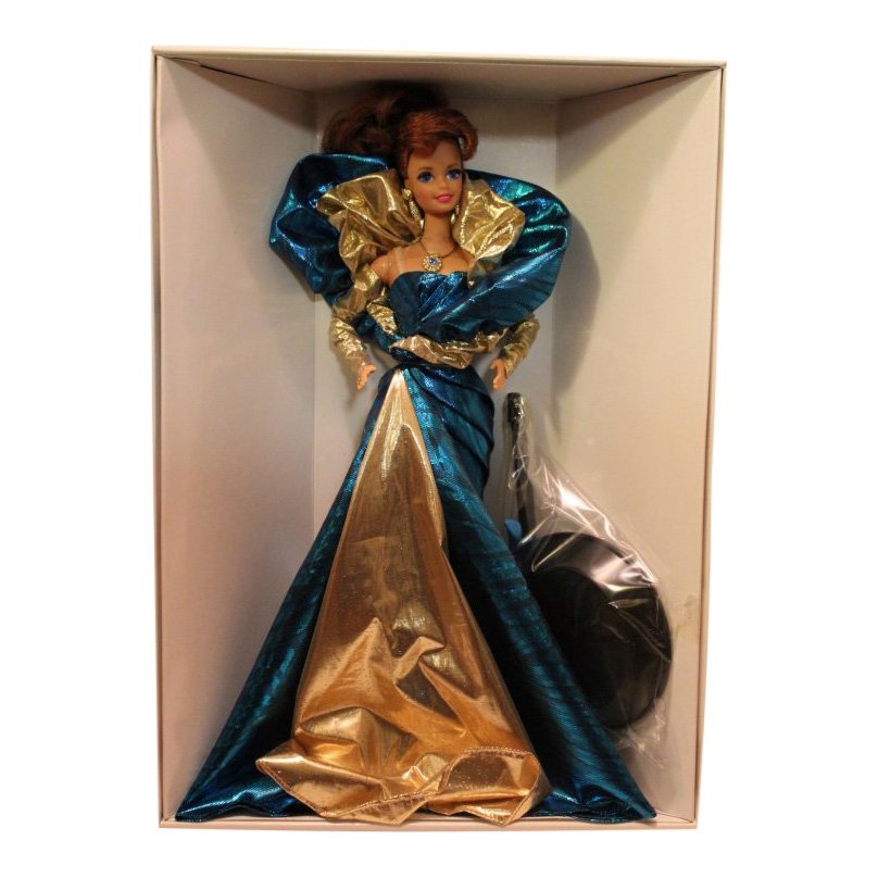 Benefit Barbie Classique Collection, 1992: Item: Benefit Barbie Classique Collection Date: 1992 Size: 11.5 inches tall Includes: Blue & gold gown, pantyhose, gloves, necklace, and doll stand First in Designer Series by Carol Spencer Out of pro