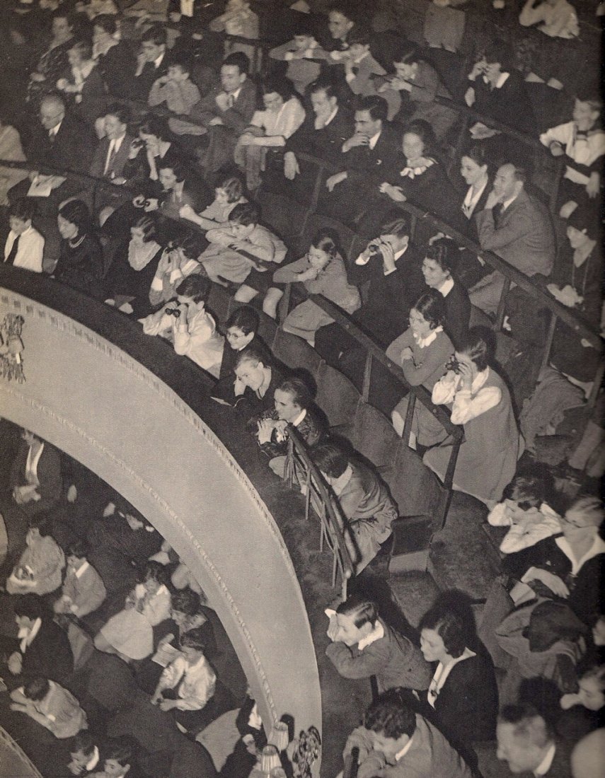 Umbo: Theatre Audience: Medium: Sheet-fed Gravure Date: 1931 Printer: Neogravure Company, France Image Size: 9 x 11 inches Umbo, or Otto Maximilian Umbehr, was a German photographer born in 1902 who worked as both a photojou