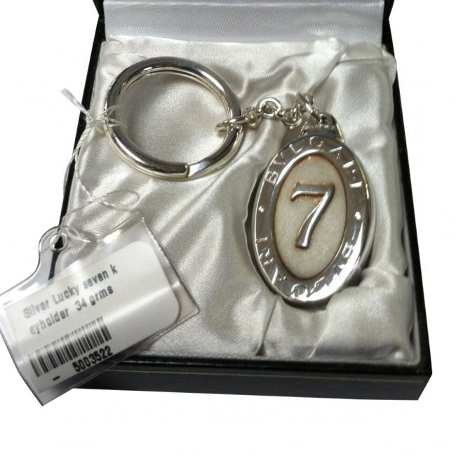 Bulgari Sterling Silver Lucky Seven Keychain: Item: Bulgari sterling silver oval keychain with lucky 7 logo Each keychain comes in fitted Bulgari box with tags Materials: Sterling silver Please note that this lot has a reserve. When you leave a b