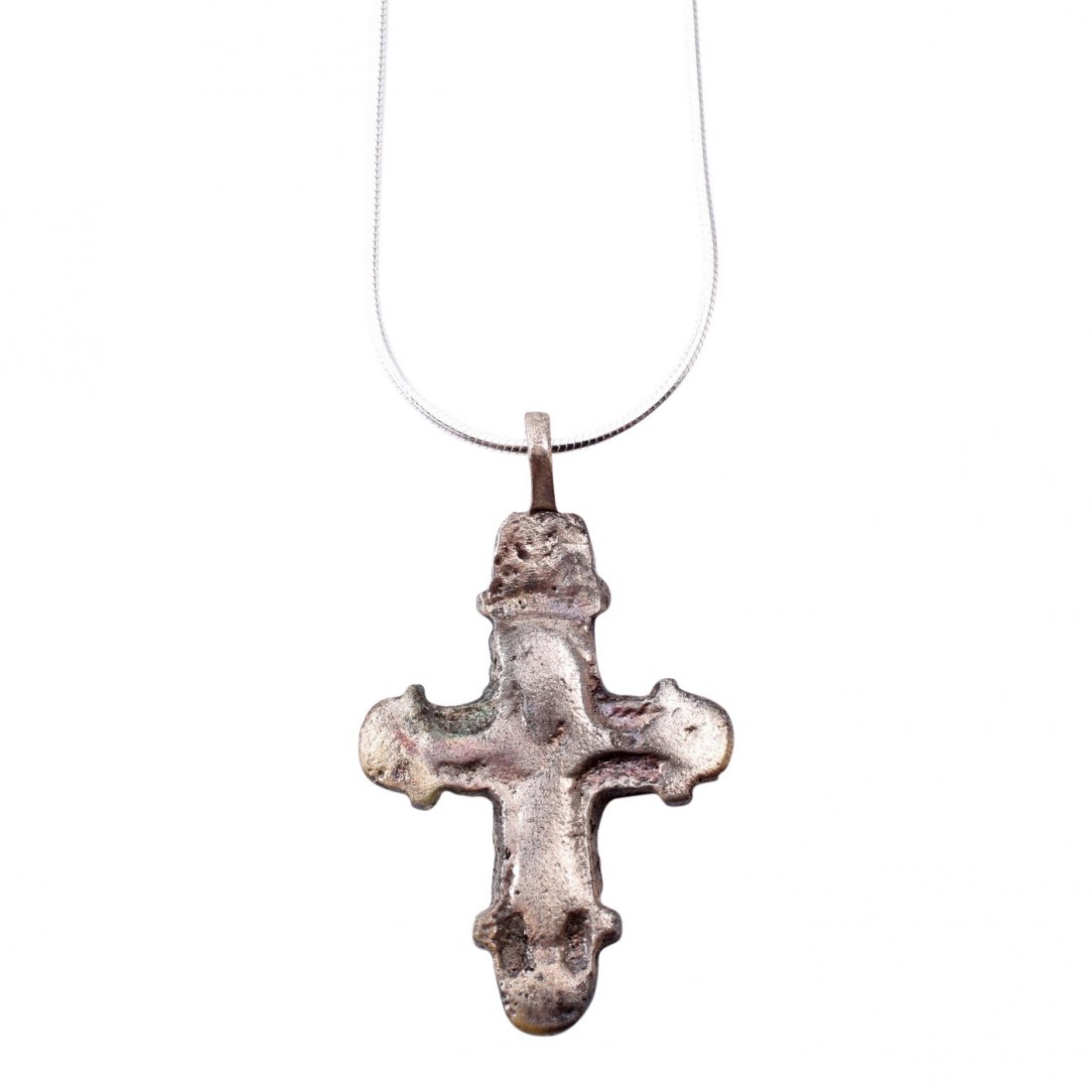 Byzantine Pilgrim's Reliquary Cross 9-12th C: Item: Byzantine Pilgrim's Reliquary Cross Date: 800-1100 A.D. Material: Silver overlay Size: 1 1/2 inches Has trefoil beam terminals and low relief stylized Corpus Christi. The back recessed for inclu