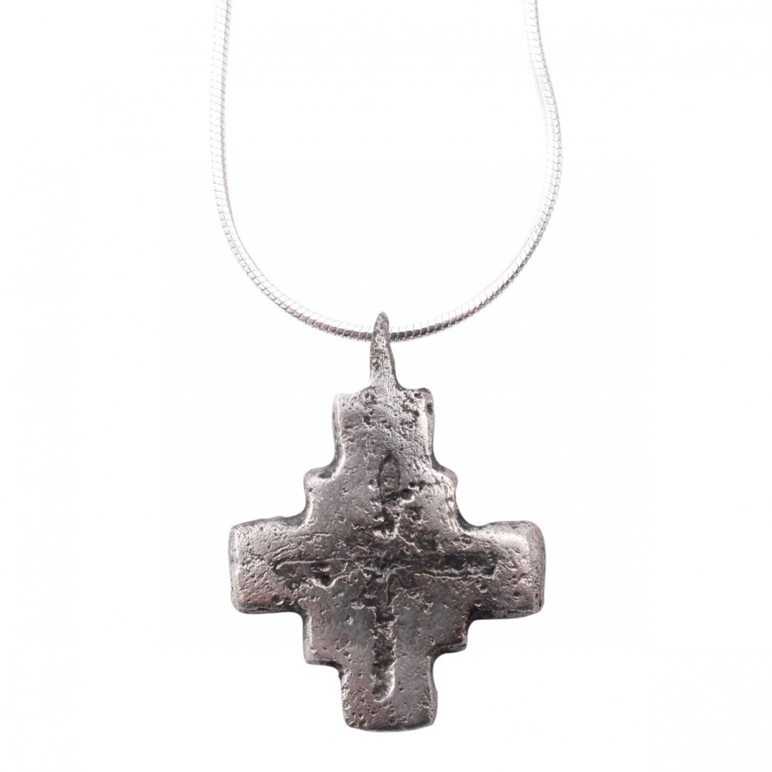 Byzantine Pilgrim's Reliquary Cross 6-9th C: Item: Byzantine Pilgrim's Reliquary Cross Date: 500-800 A.D. Material: Silver overlay Size: 1 inch Symmetrical with both beams of the same length and the center with a square. The beams with remnants 