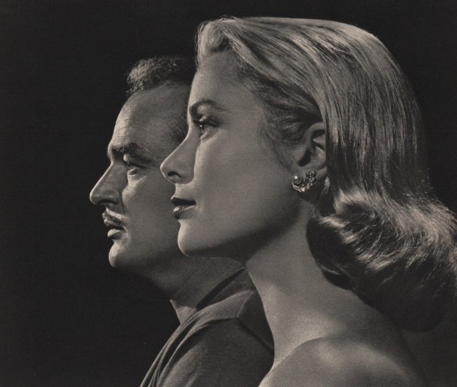 Yousuf Karsh: Prince Rainier & Princess Grace: Title: Prince Rainier & Princess Grace Artist: Yousuf Karsh Medium: Vintage Sheet-Fed Gravure Date: 1960 Printer: Enschede & Sons, Netherlands Image Size: 9 x 8 inches Yousuf Karsh was an Armenian-Can
