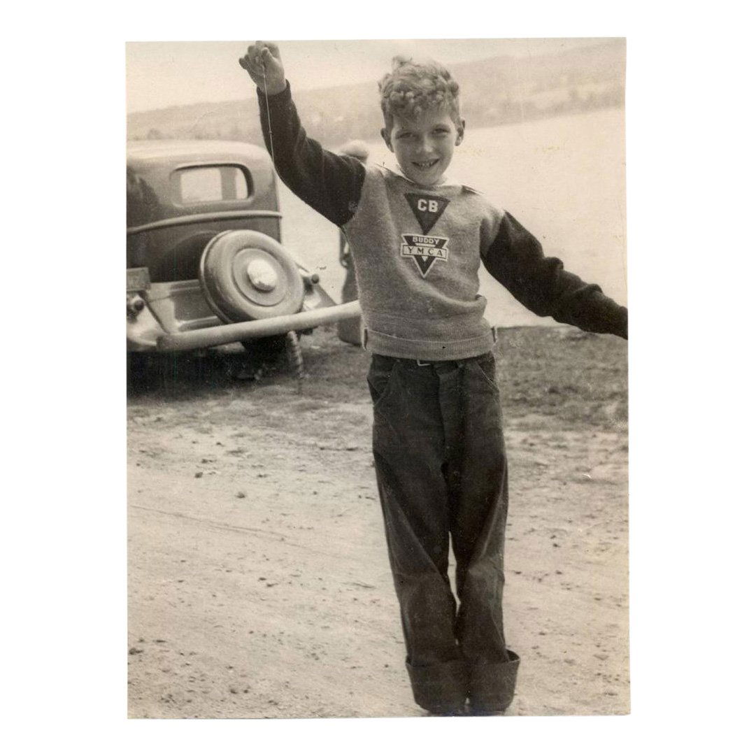 Vintage Photo of Boy Holding Caught Fish, 1930: Item: Vintage Photograph Happy boy holds up his latest catch while wearing a YMCA sweater Date: ca. 1930's Size: 7 x 9 3/8 inches Unmounted Please note that this lot has a reserve. When you leave a bi