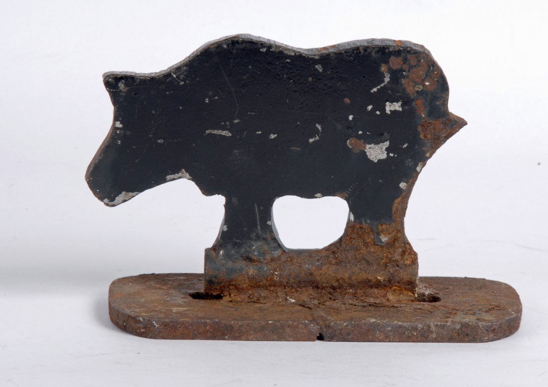 Cast Iron Shooting Gallery Bear, c 1920: Item: Cast iron shooting gallery target in the form of a bear mounted on a gun barrel Maker: Possibly Winchester Gun Manufacturing Co. Material: Cast iron Date: Circa 1920's - 30's Dimensions: 4.25 x