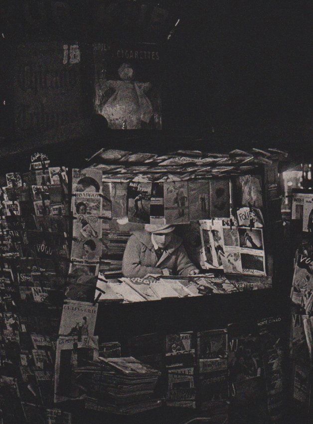 Brassai: Magazine Kiosk: Print Title: Magazine Kiosk Artist: Brassai Mediium: Sheet-Fed Gravure Printer: La Societe D'Impressions Lorraines - Nancy, France Print Date: 1987 Image Size: 7 x 9.5 inches Brassai was a Hungarian-F