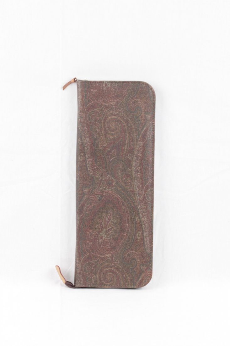 Etro Brown Paisley Travel Tie Case: Item: Etro Brown Paisley Travel Tie Case Brand: Etro Material: Canvas Interior lining: Tan leather Internal sections: 2 tie bars - 1 small flap sections for tie clip Measurements: 16 1/4 x 6 1/4 x 1 i