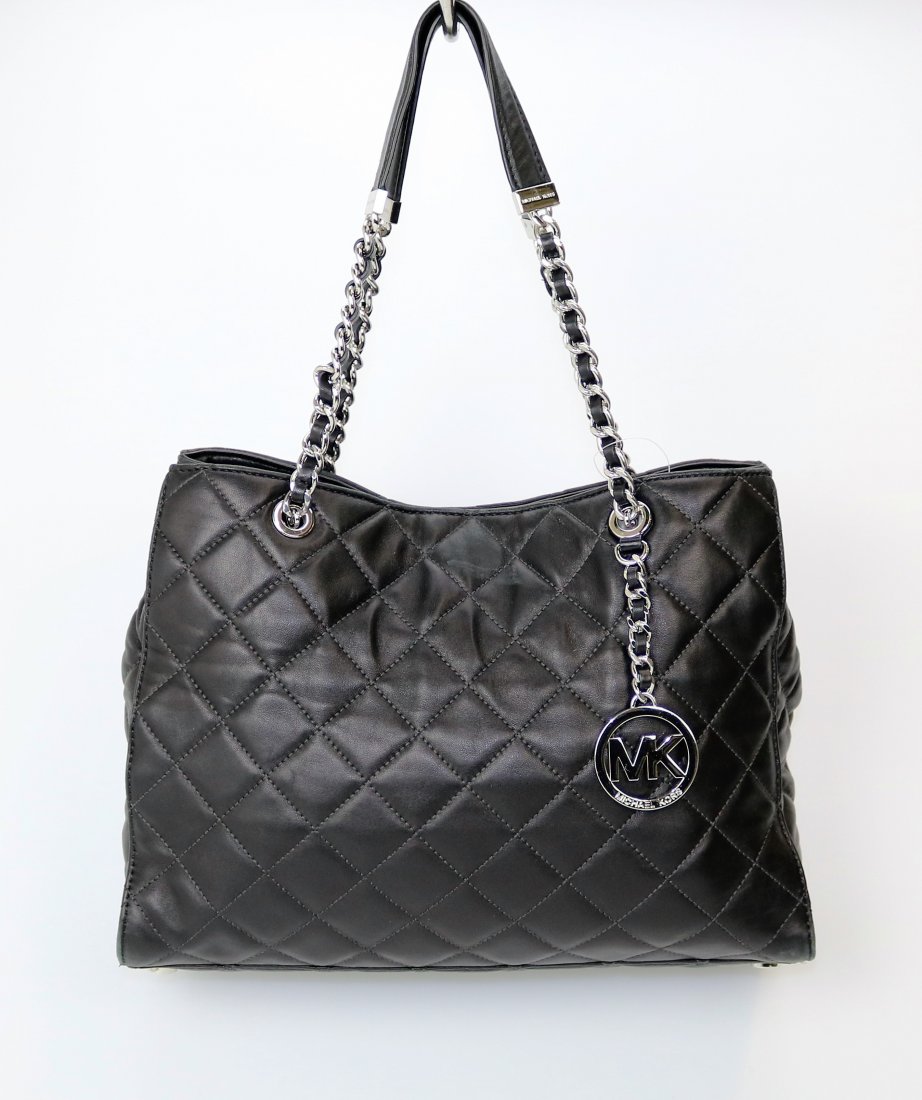 Michael Kors Susannah Tote: Item: Michael Kors Susannah Tote Brand: Michael Kors Material: Nappa leather Silver hardware Measurements: 16 x 10 x 4 inches Very Good Condition: There is color loss on the corners. Michael Kors is a