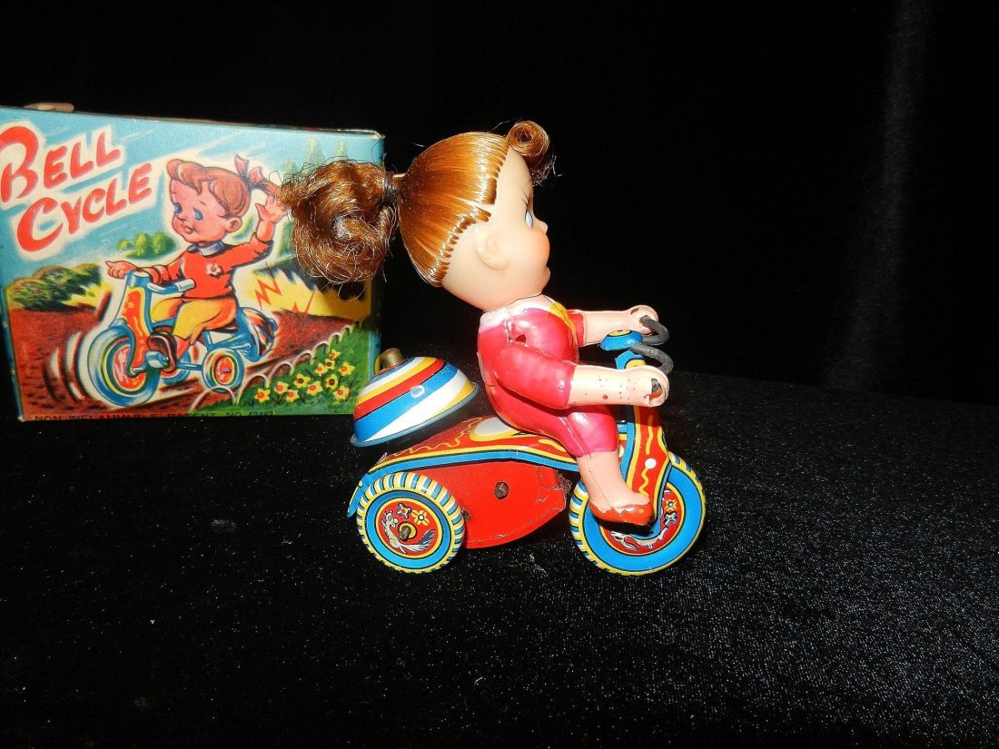 Vintage Wind Up Bell Cycle Toy Girl on Tricycle: Toy: Vintage Wind Up Bell Cycle Toy Girl on Tricycle Origin: Japan Has original box Size: 4 inches tall and 3.75 inches in length No Reserve: This lot starts at $1 and has no reserve as a courtesy so 