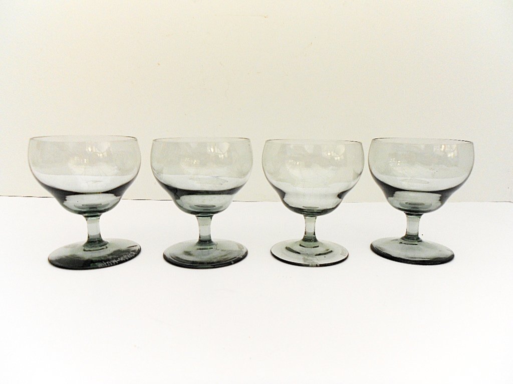4 Daum Nancy Smoked Liquor Glasses, 1930: Item: 4 Daum Nancy Smoked Liquor Glasses Weight: 9oz Size: 2 7/8 inches high x 2 1/4 inches diameter at rim All pieces marked Origin: Made in France Date: ca. 1930 Please note that this lot has a rese
