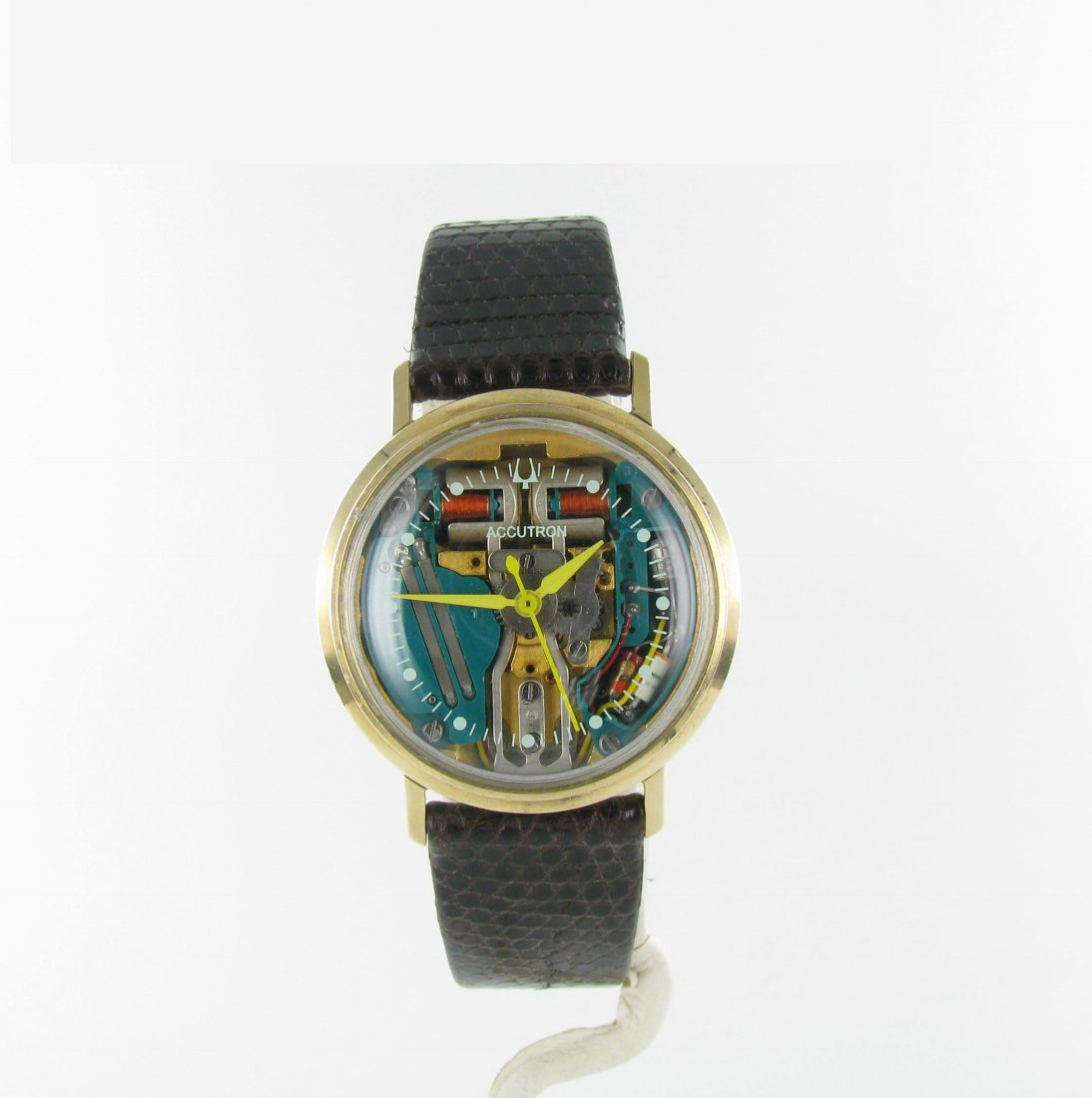 Bulova 10K Gold Filled Accutron Watch, 1963: Domestic: Free Shipping Item: Bulova 10K Gold Accutron Watch Materials: 10K gold filled, lizard strap Date: 1963 Watch has been serviced, and has been regulated to run on readily available silver oxid